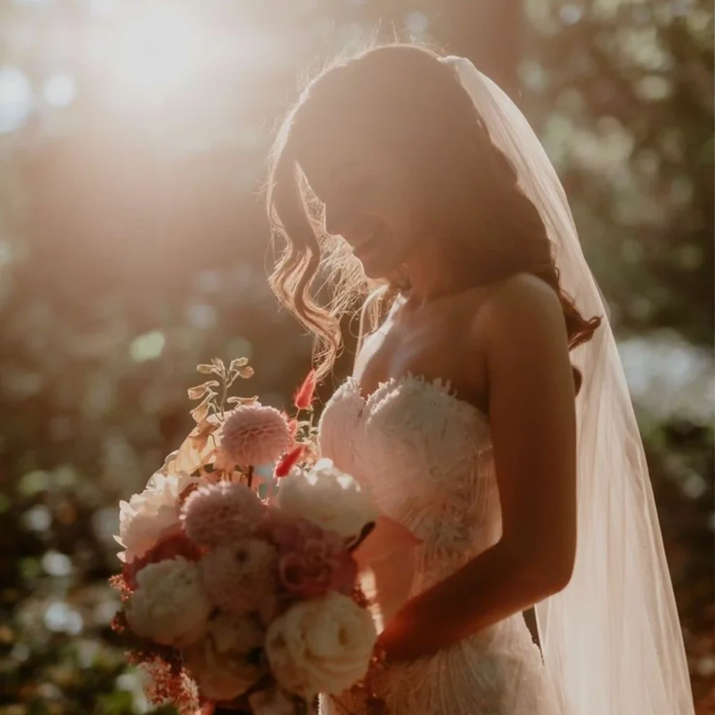 wedding photography in calicut , bride with flowers in natural sunlight