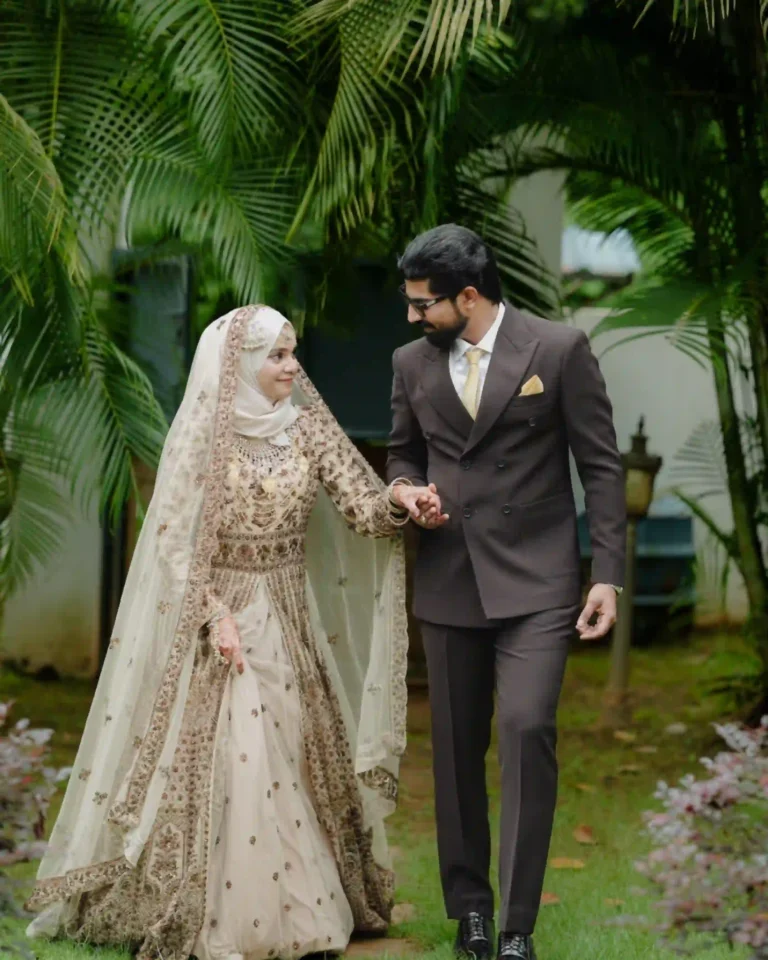 wedding photography in calicut , bride and groom looking each other by holding hands