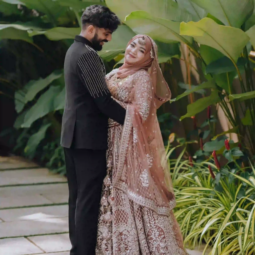 wedding photography in calicut , groom holding bride